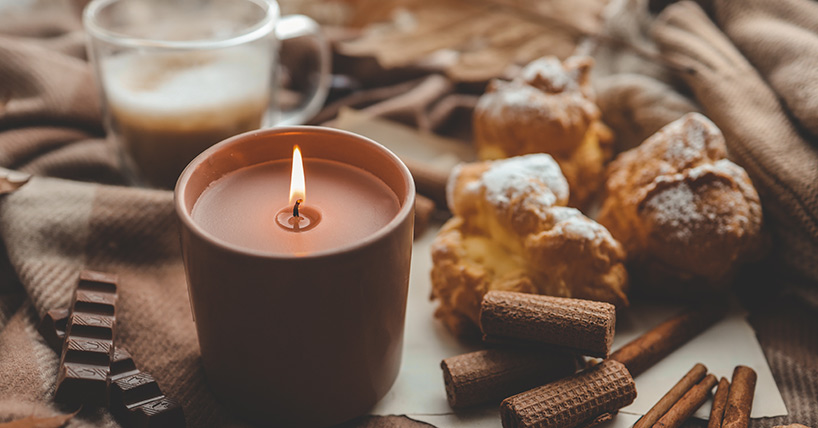 Burning candle with the smell of chocolate and cinnamon