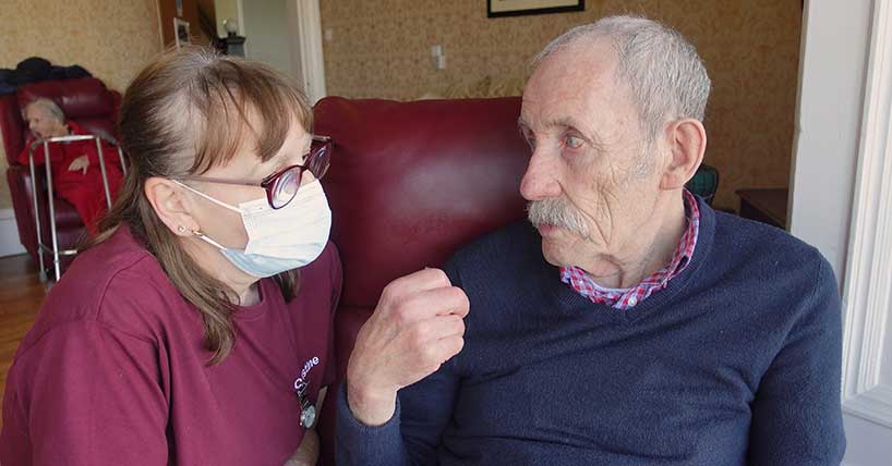 A carer and resident in the documentary CARE