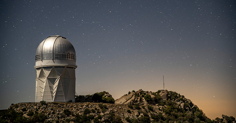 Photograph of the Mayall Telescope, which hosts the Dark Energy Spectroscopic Instrument, at Kitt Peak National Observatory.
